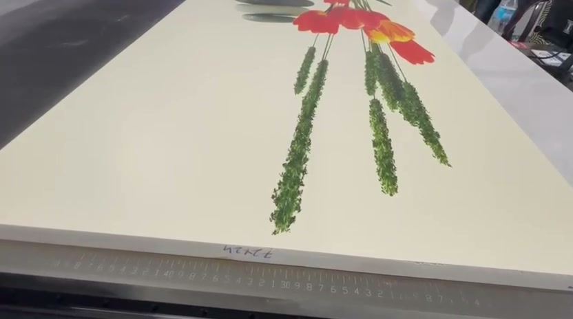 Close-up of a finished rigid-media print with the bed's measurement scale visible
